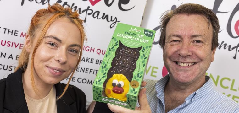 Danika and Mike Woods from Just Love Foods with Archie the caterpillar cake