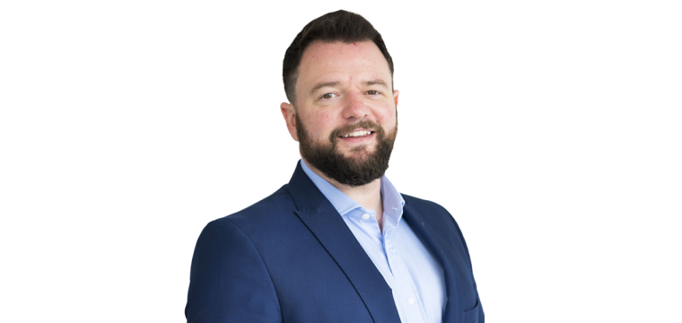 Cenydd Rowlands Property Director smiling wearing a blue suit