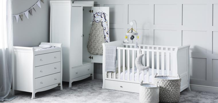 Nursery room with white furniture