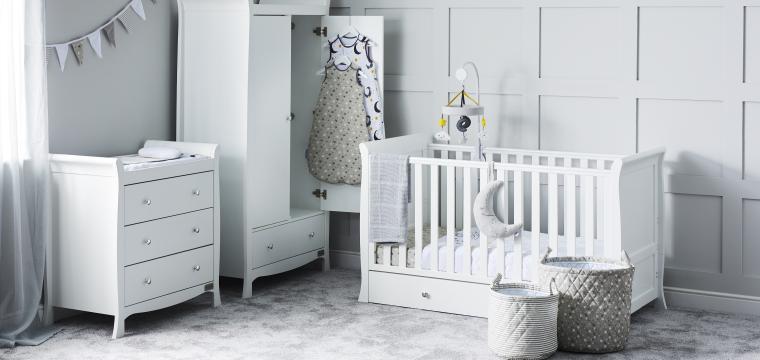 Nursery room with white furniture