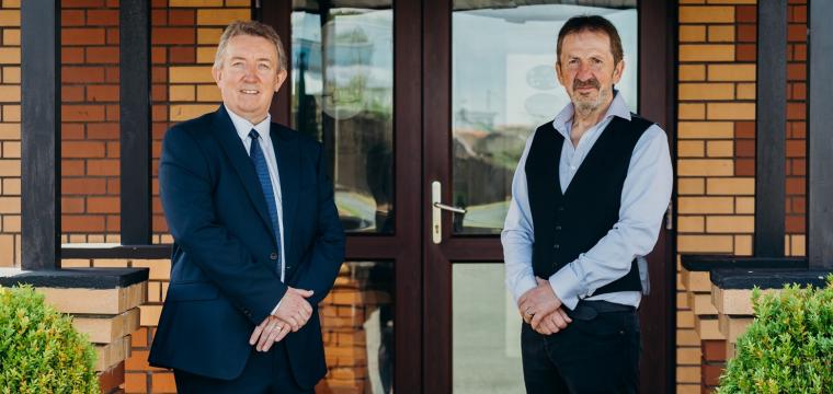 Richard Easton (the Development Bank) and Mike Davies (Dale Roads) stood in front of Dale Roads entrance 