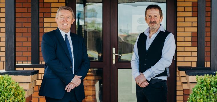 Richard Easton (the Development Bank) and Mike Davies (Dale Roads) stood in front of Dale Roads entrance