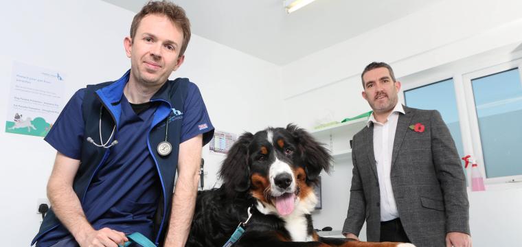 Chief Executive Owen Monie and his dog with Scott Hughes. 