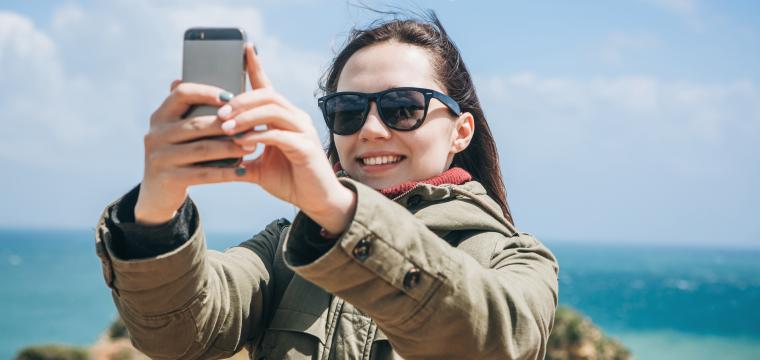 Women taking a selfie on her mobile phone