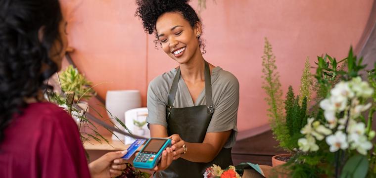 Woman taking card payment in a shop