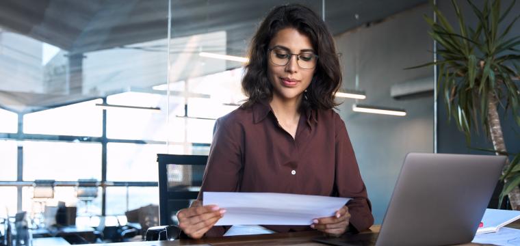 A woman reviewing a document
