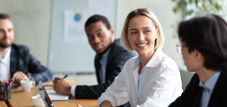 A group of people in a business meeting
