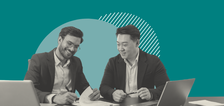 Two men working on a document