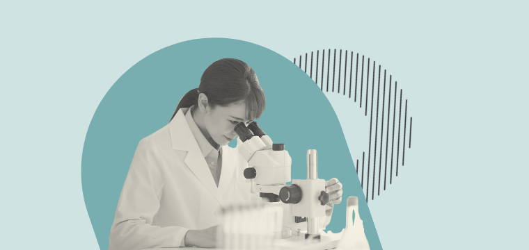 A woman using a microscope