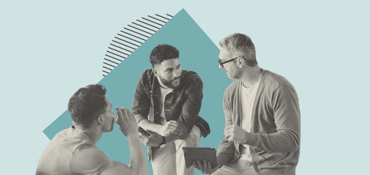 Colleagues chatting around a desk