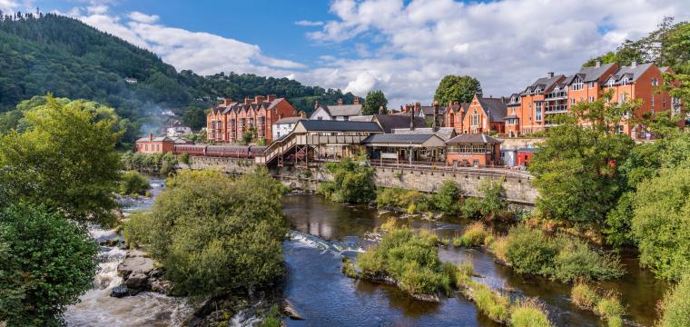 A photo of Llangollen town along the banks of the River Dee in North Wales