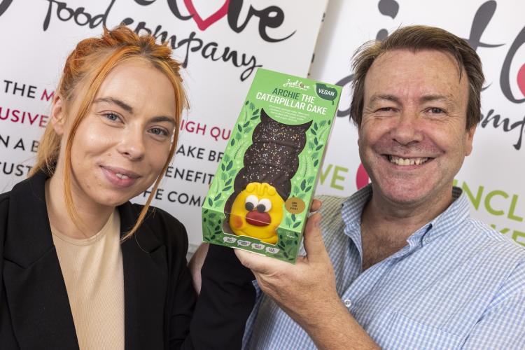 Danika and Mike Woods from Just Love Foods with Archie the caterpillar cake