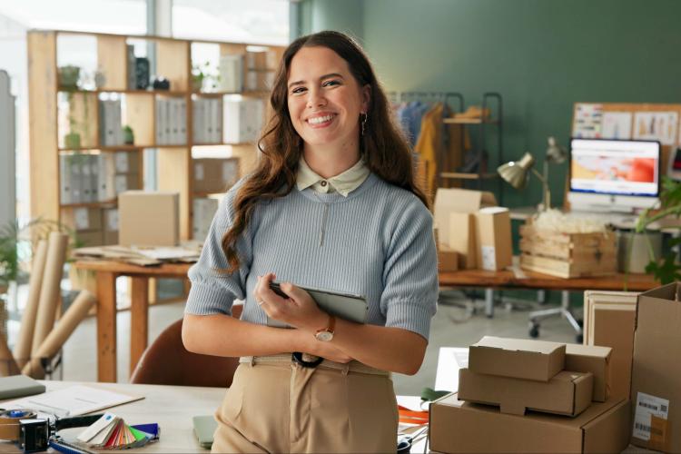 A woman standing with an ipad