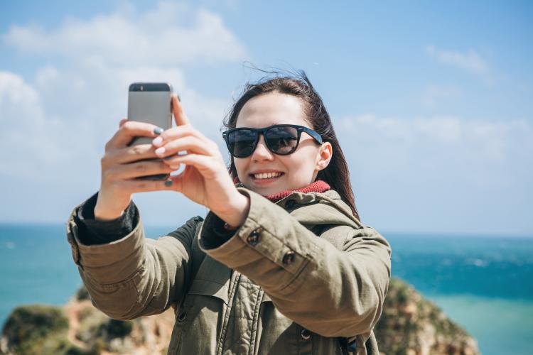 Women taking a selfie on her mobile phone