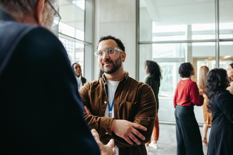 People chatting at a networking event