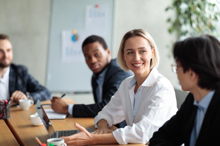 A group of people in a business meeting