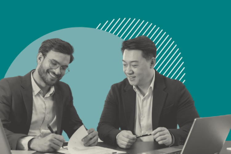 Two men working on a document