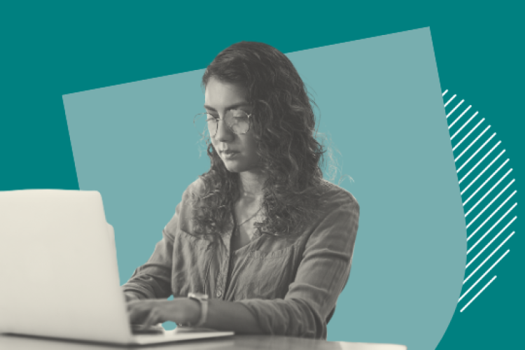 A woman working at a laptop