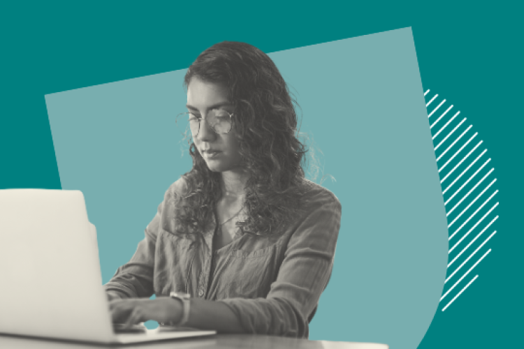 A woman working at a laptop