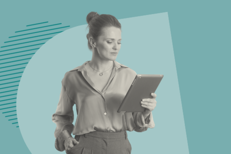 A woman standing with an ipad