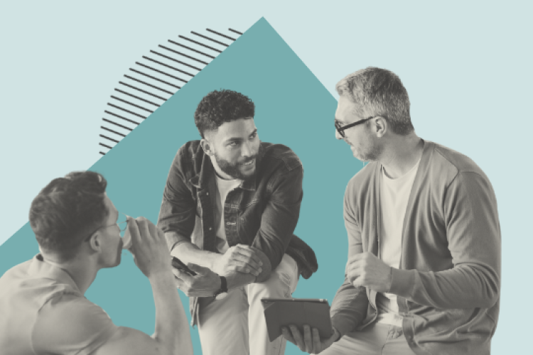 Colleagues chatting around a desk