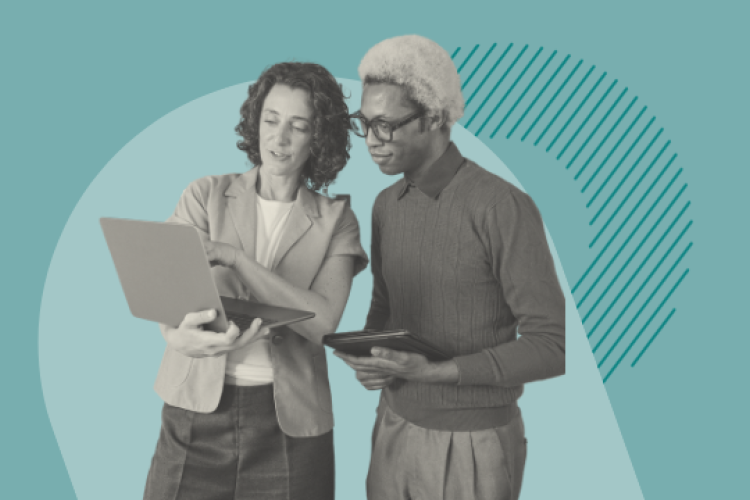 Two people reviewing a laptop