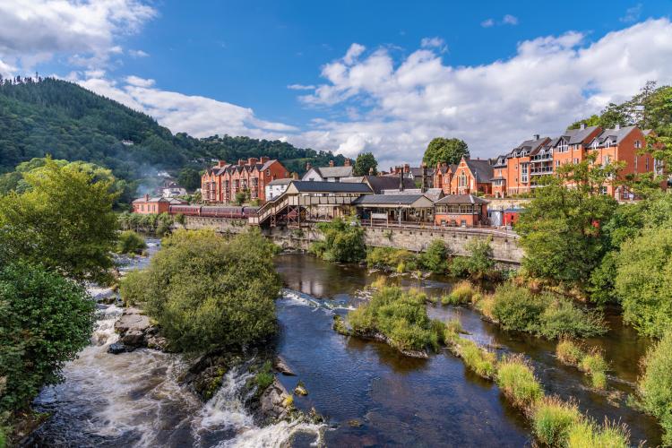 A photo of Llangollen town along the banks of the River Dee in North Wales