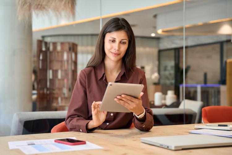 A woman working on a tablet